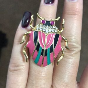 Big bug ring , in pink, gold and green.